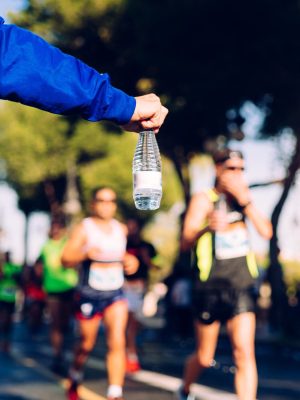 a-helping-hand-delivers-a-bottle-of-water-to-a-run-2025-10-14-07-21-55-utc-scaled.jpg