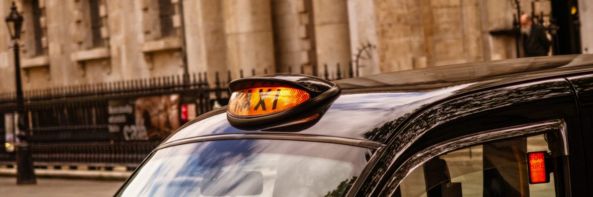 A view of London black cab taxi for hire around Trafalgar square
