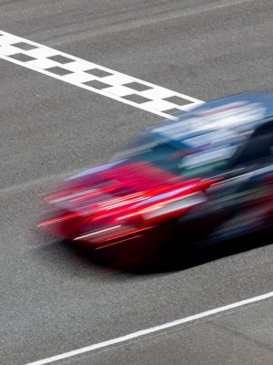 motion-blur-race-car-racing-on-speed-track-car-ra-2025-01-10-03-35-05-utc-scaled.jpg