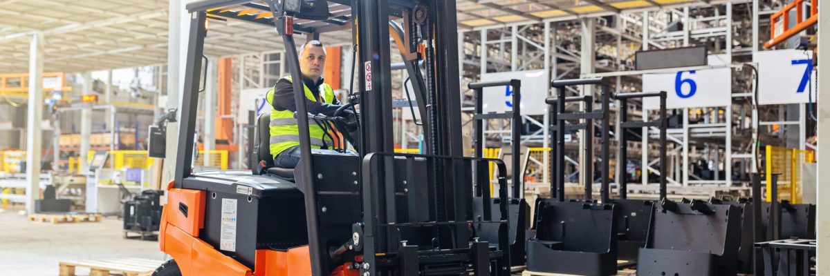 storehouse-employee-in-uniform-working-on-forklift-2024-11-07-13-19-21-utc